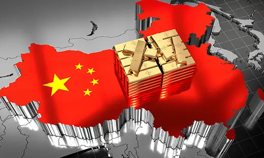Chinese gold imports surge as demand rises with gold bars stacked over a map of China.