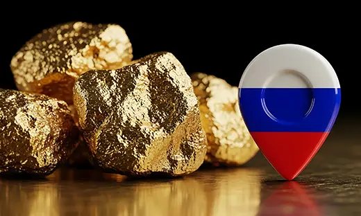 Gold nuggets beside a Russia map marker illustrating Russia's expanding gold production and strategic gold reserves
